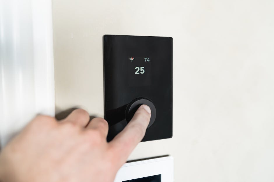 Smart thermostat on a wall