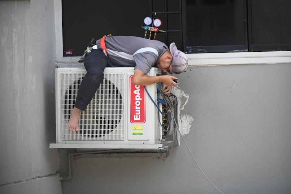 Technician repairing an HVAC unit